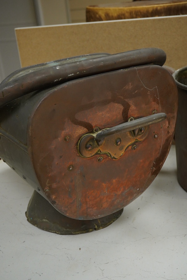 A copper watering can and a helmet coal scuttle, watering can 40cm high. Condition - interior of coal scuttle rusty, both need cleaning